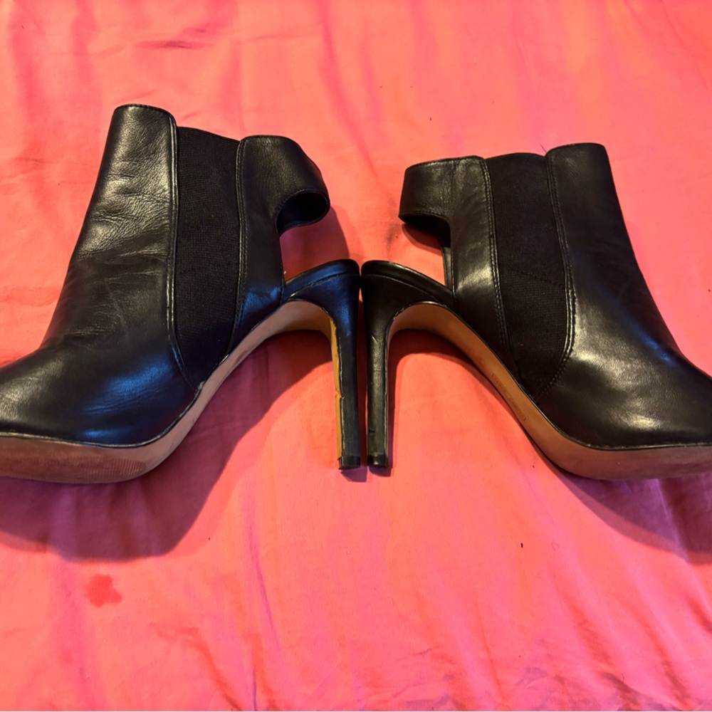 Vince Camuto, leather open toe and open back construction makes this a favorite